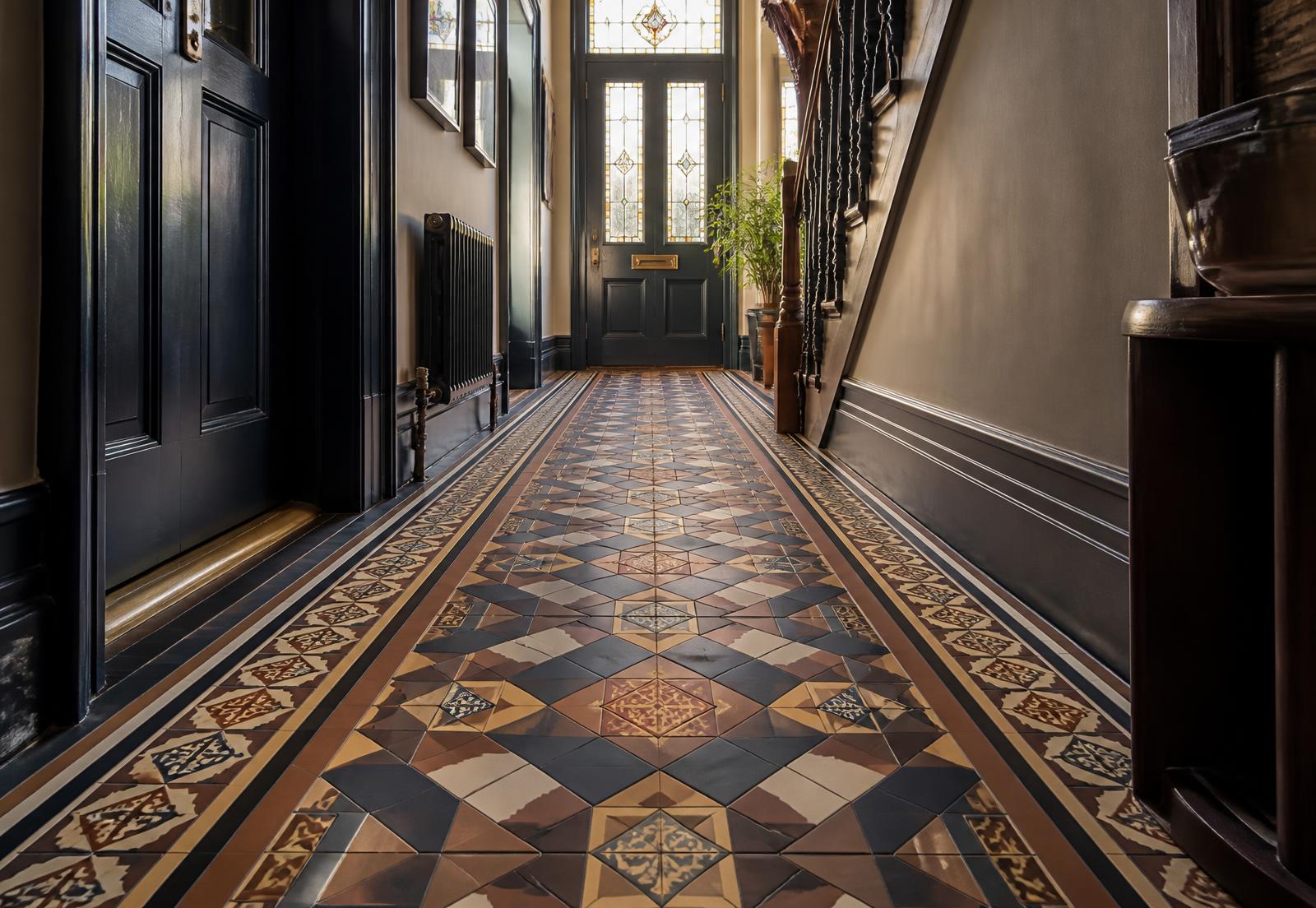 Newly installed Victorian geometric tiled hallway in a London townhouse